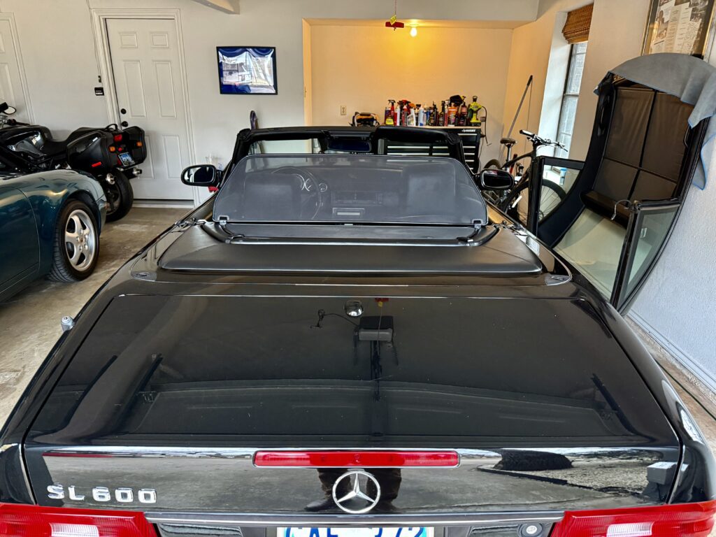 Black Mercedes SL600 parked in garage.