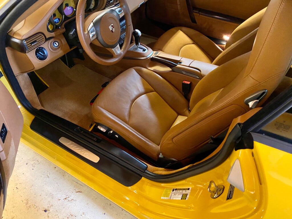 Yellow car with tan leather interior.