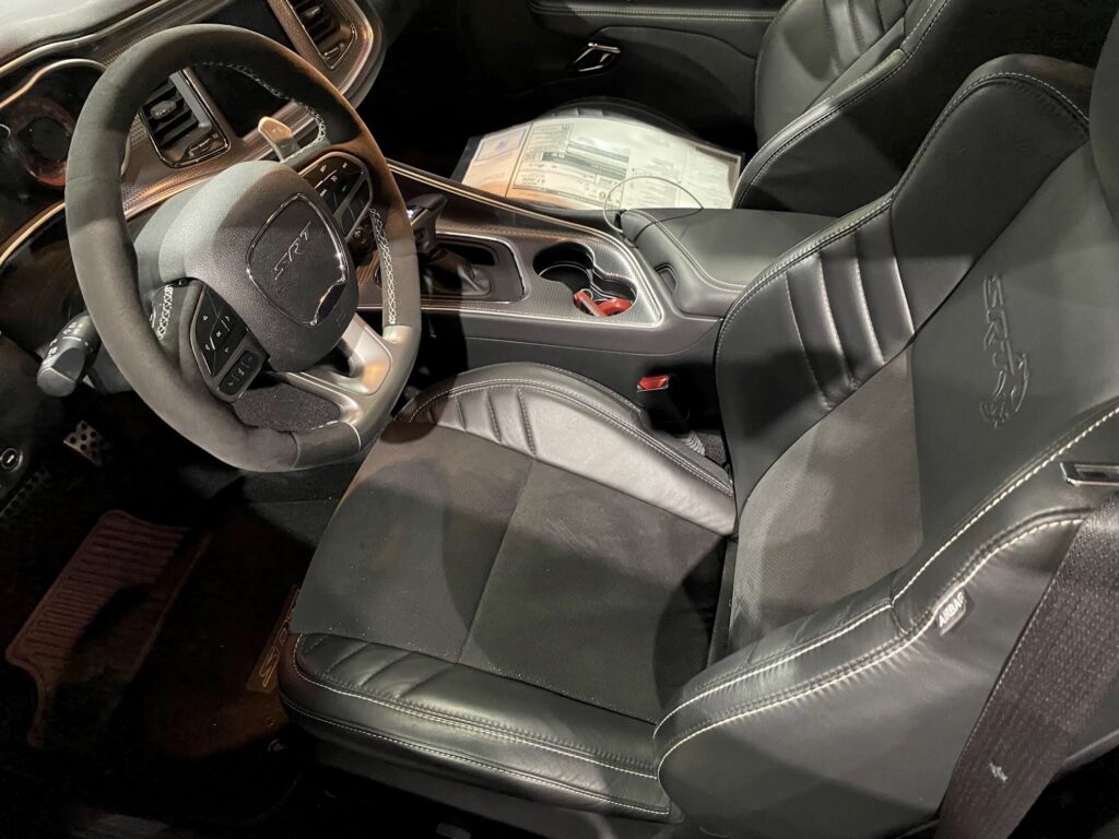 Car interior with black leather seats.